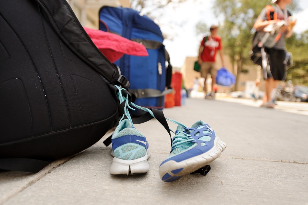 With running shoes symbolizing the activities to come, nearly 250 students move into Sullivan Residence Hall at the start of the weeklong camp for cross-country and middle-distance runners.