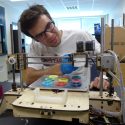 Chase Haider adjusts a commercial 3-D printer as he develops an add-on device that allows the printer to produce color objects. Haider and Cédric Kovacs-Johnson invented the device as chemical engineering students. The pair plan to form a company called Spectrom to advance their invention. Photos: David Tenenbaum