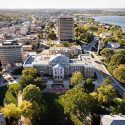 Photo: Central campus in aerial view with Bascom Hall in center and Van Hise Hall in the background.