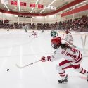 Freshman defenseman Lauren Williams (14) passes the puck.