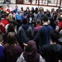 Members of the University of Wisconsin-Madison campus community gather at a vigil Feb. 10 mourning the University of North Carolina students slain near that campus. (Photo courtesy Betsy Osterberger)