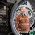 Photo: Rock Mackie standing in front of a machine