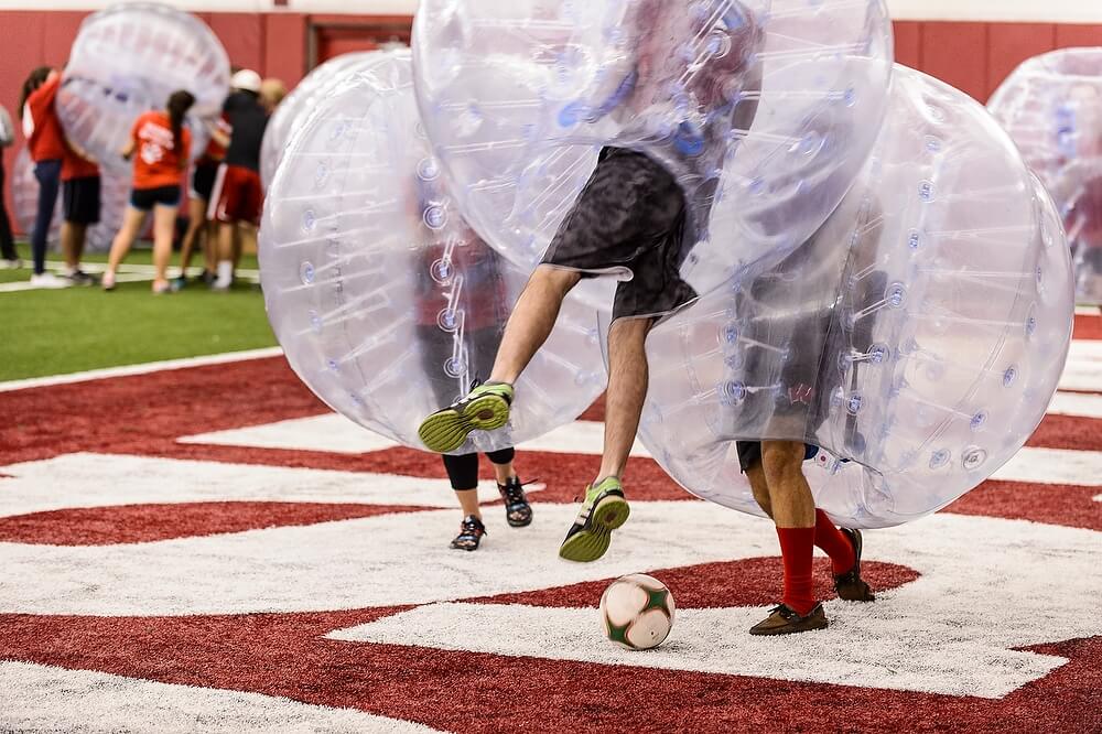 Earlier in the week, students broke into teams, donned giant inflatable spheres and battled for the ball during a game of bubble soccer at the McClain Center.
