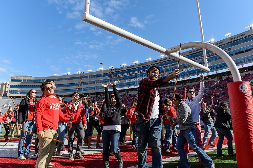 After running the length of the field, law students (including Marc Pawlus, in plaid) toss their canes over the south goal post before the game. Law School lore dating back to the 1930s holds that those who catch their cane on the other side will win their first case; those who don't will have to settle.
