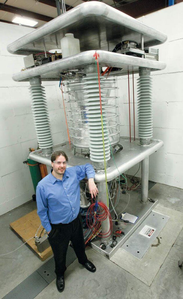 Photo: Piefer standing next to machine