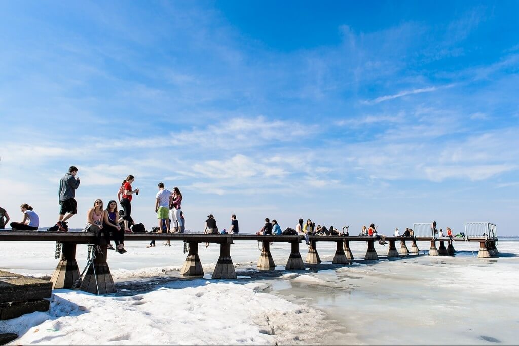 What to do when it’s 64 degrees in March? Why, put on shorts and walk out on the still-frozen Lake Mendota, of course.