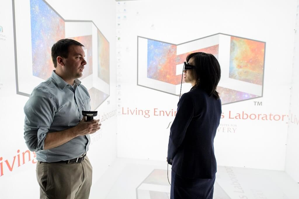 Goggles in place, Michelle K. Lee, right, director of the U.S. Patent and Trademark Office, tours the Discovery Building’s Living Environments Laboratory with faculty member Kevin Ponto.