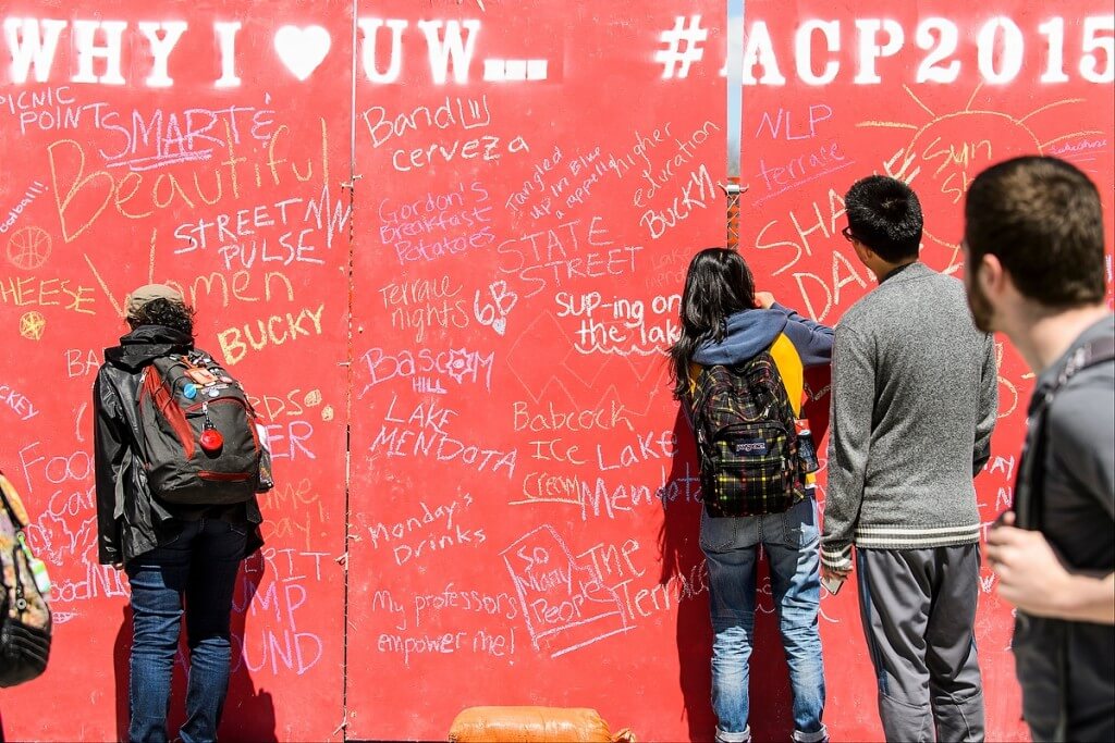 Why do we love the UW? Let us count the ways — and write them on a chalkboard during the Bucky’s Day Off event, part of the annual All Campus Party held on Library Mall.