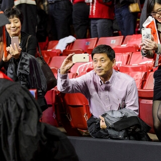 Guests zoom in on their graduates.