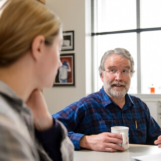 David Brow, professor of bimolecular chemistry, meets with graduate student Allyson Dill in the Deluca Biochemical Sciences Building at the University of Wisconsin-Madison on Feb. 8, 2016. Brow is one of twelve 2016 Distinguished Teaching Award recipients. (Photo by Bryce Richter / UW-Madison)