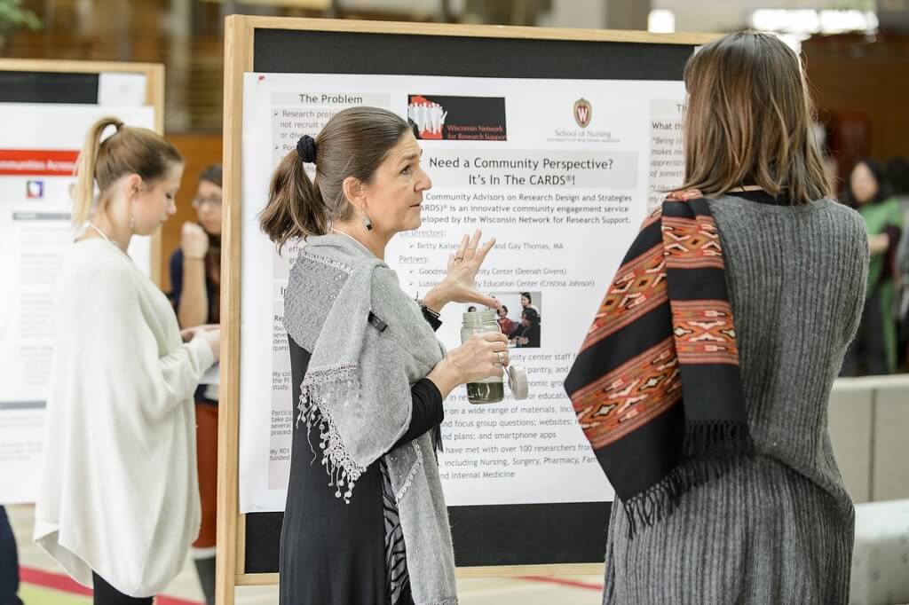 Presenters discuss details of their projects as the Town Center bustled with activity.