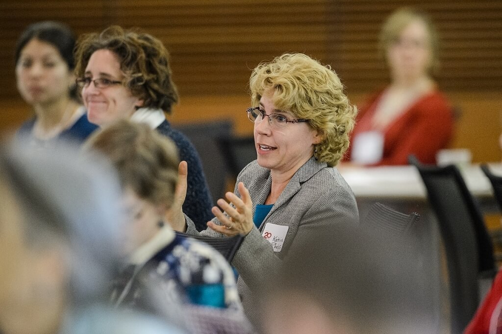 Audience members listen to speakers at the Campus & Community Summit celebrating the 20th anniversary of the Morgridge Center for Public Service.