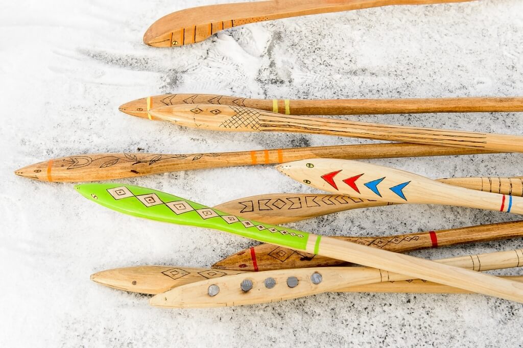 A collection of snow snakes sits waiting to be used at Ojibwe Winter Games, held on Lake Mendota at the University of Wisconsin-Madison on Feb. 5, 2016. Events included snow snake, hoop and spear, and atlatl, where participants propel an arrow with a hooked handle.