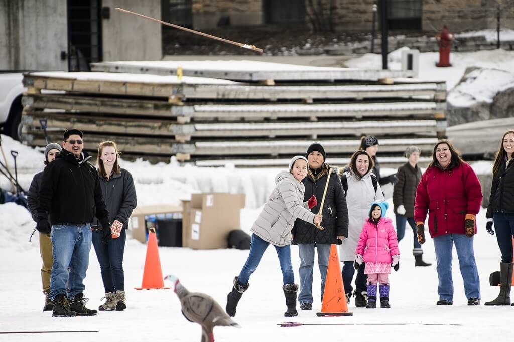 The games included snow snake, hoop and spear, and atlatl (shown), where participants use a hooked handle to propel an arrow faster and farther than could be thrown with bare hands.  The object was to hit one of four hunting targets. 