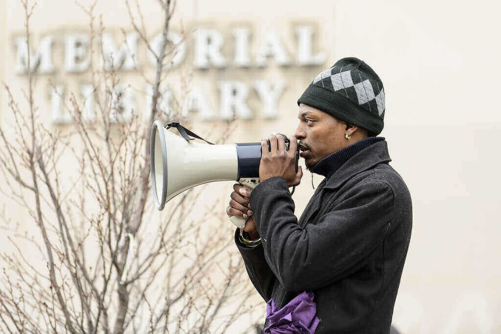 Eric Upchurch, a 2010 UW-Madison graduate and founding member of the Young Gifted and Black Coalition, speaks to participants.