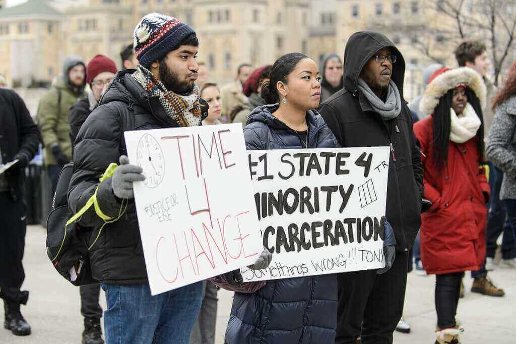 Marchers carried signs expressing strong feelings about issues raised by the Robinson shooting and other events affecting the African-American community.