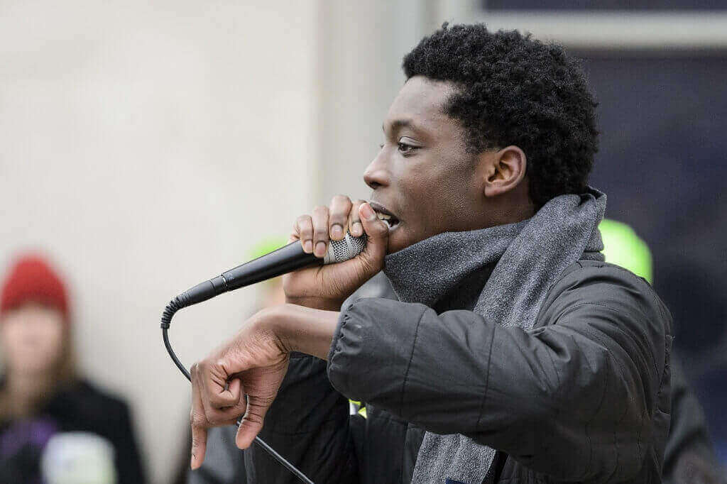 UW student Tyriek Mack, a  campus leader in the BlackOut movement and member of the Black Student Union, addresses the crowd.