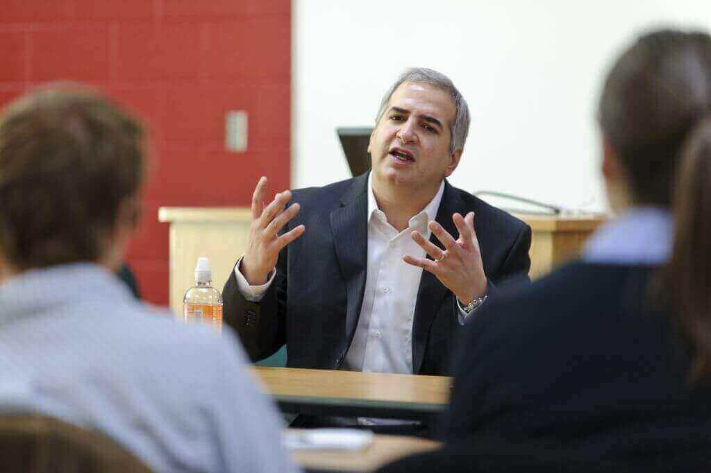 Anthony Shadid (center) speaks to a group of journalism students in a Vilas Hall classroom in December 2010.