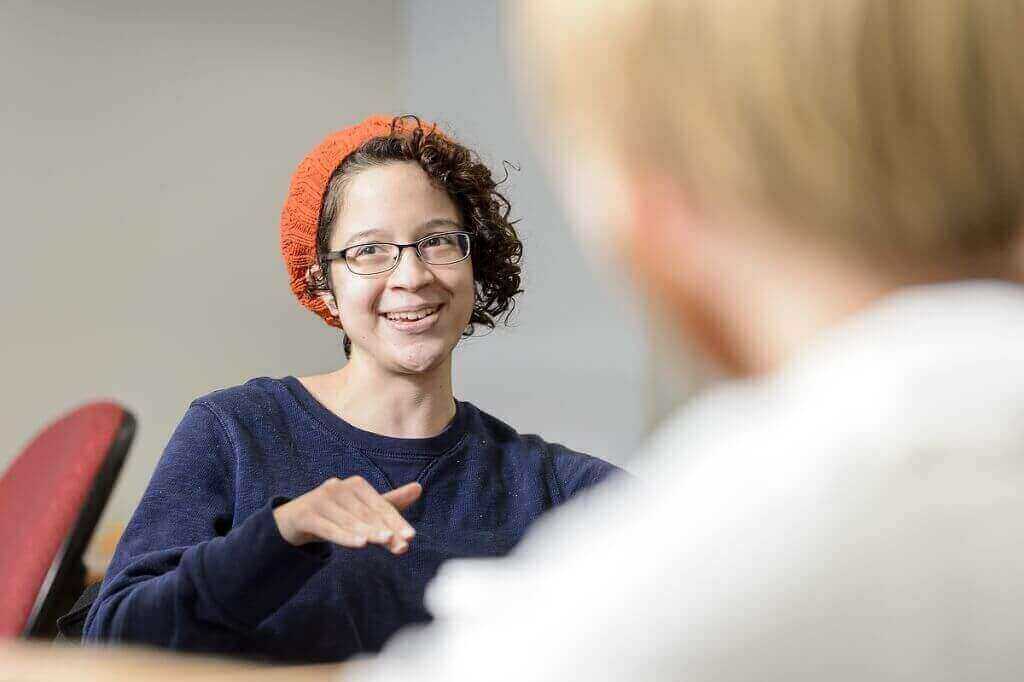 Melanie Loppnow, a junior studying computer science, discusses a concept with her WES-CS peers.