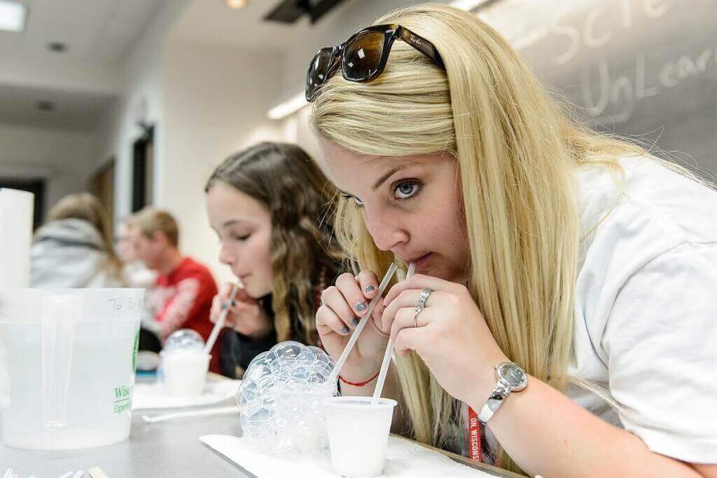 Photo: Sisters testing milk bubbles