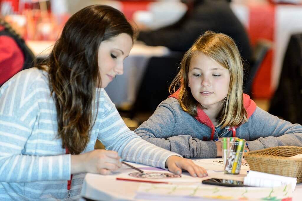 Photo: Sisters coloring pictures