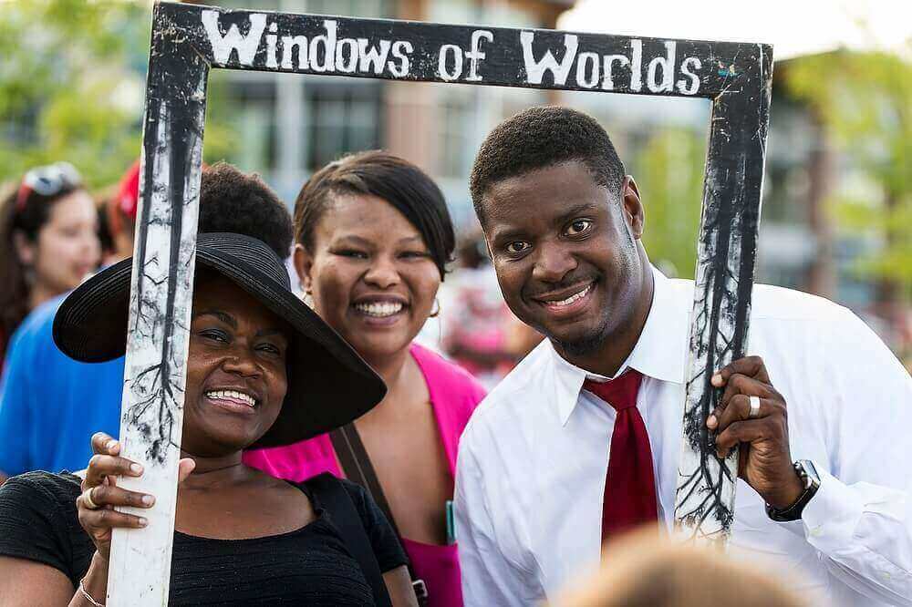 Everett Mitchell poses for a photo with, left to right, Queen Turner and Missey Russell at the second annual South Madison International Community Night. Mitchell counts the university's expanded presence in South Madison as one of his biggest achievements.