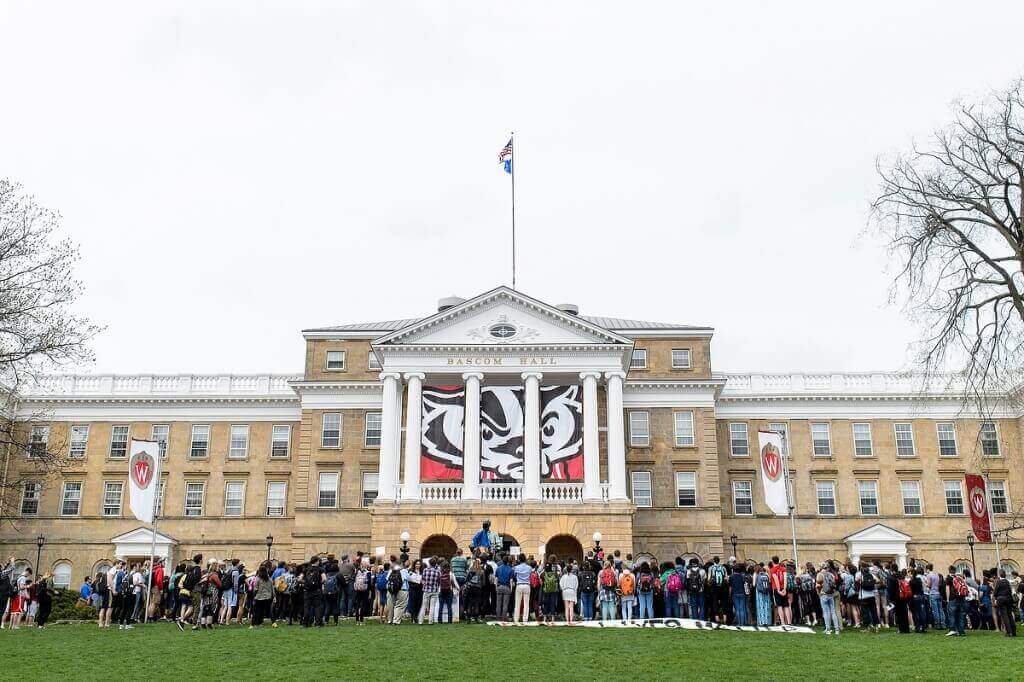 Students, faculty, staff and other supporters gather in front of Bascom Hall for a protest against racism on April 21, 2016.