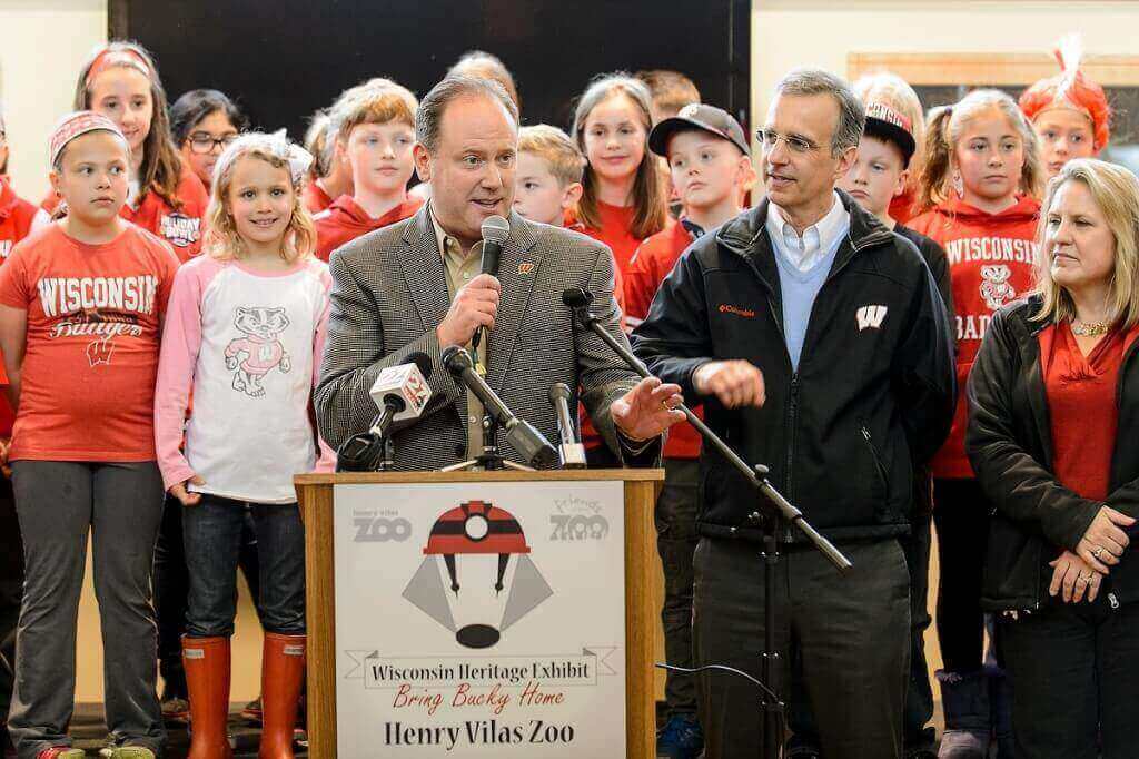 Surrounded by representatives of the Henry Vilas Zoo and the Madison community, UW basketball coach Greg Gard speaks at a press conference announcing the 