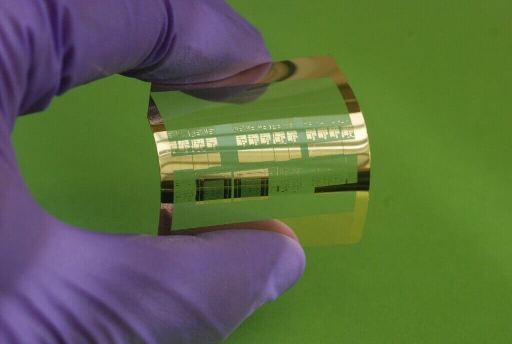 Photo: Flexible transistor held in gloved hand