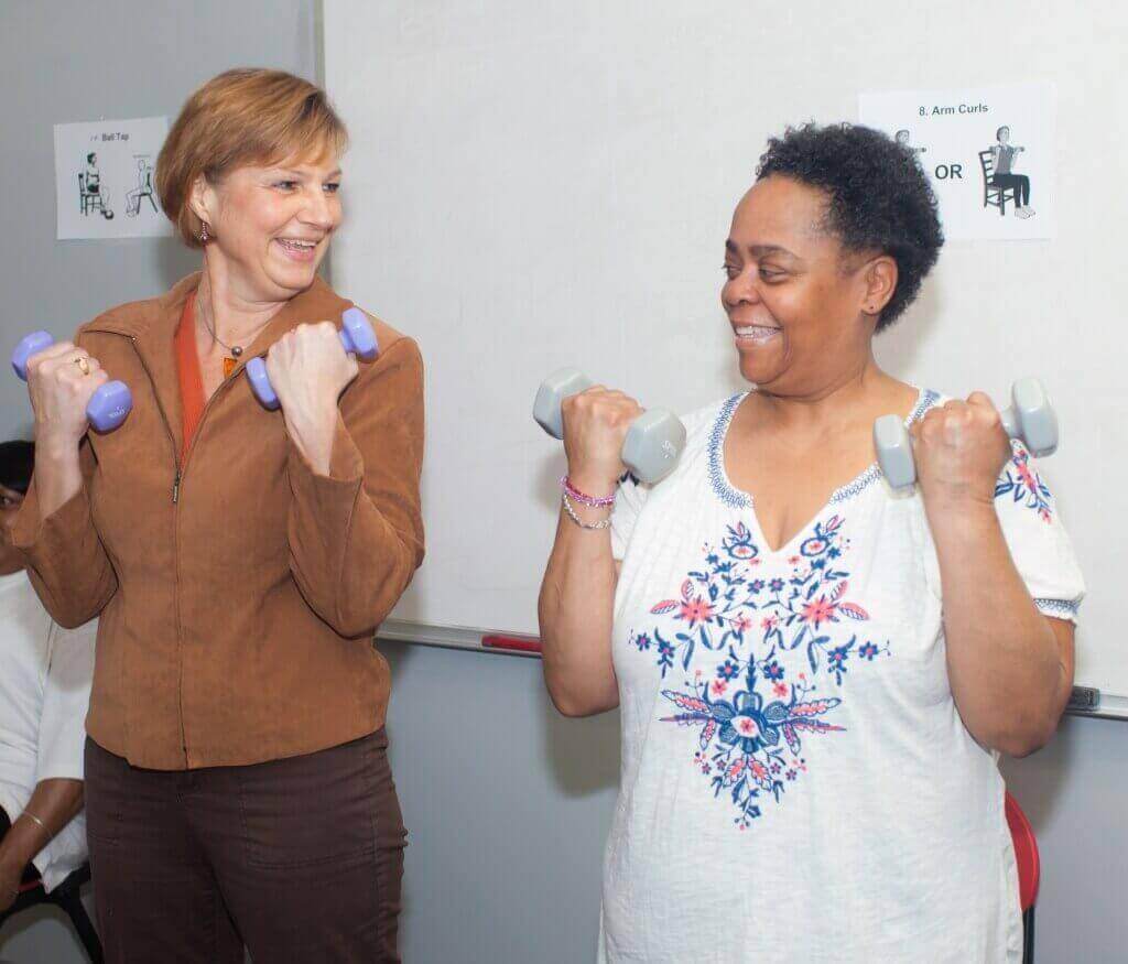 Kim Gretebeck, assistant professor of nursing at UW–Madison, and Pamela Bracey demonstrate the exercise program Gretebeck has developed for senior citizens.