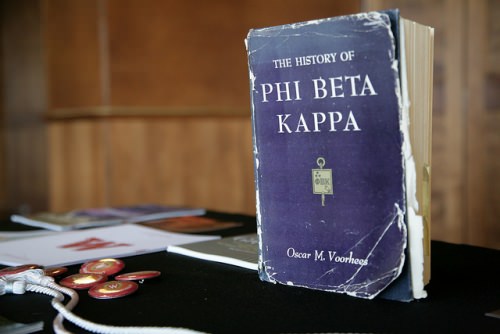 A well-thumbed book of Phi Beta Kappa history welcomes new initiates and their families to the 2016 spring banquet.