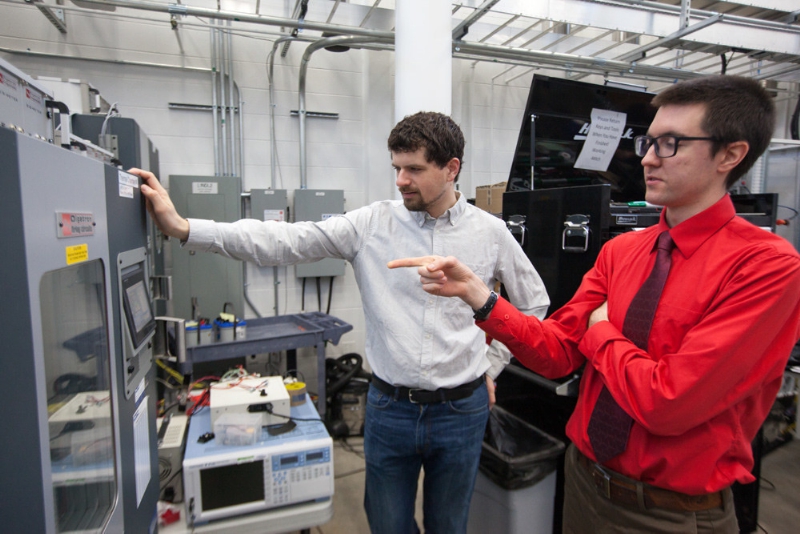 Johnson Controls Fellows Kevin Frankforter (left) and Jacob Dubie are pictured in the Johnson Controls Energy Storage Research Lab at the Wisconsin Energy Institute on the UW–Madison campus. (Photo by Matthew Wisniewski)