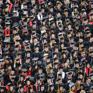 Orderly rows of graduates covered the football field in Camp Randall.