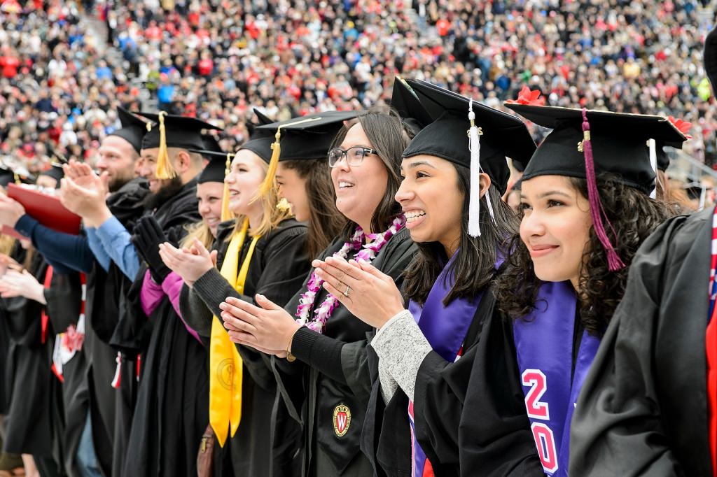 Graduates celebrate as they sing Varsity.