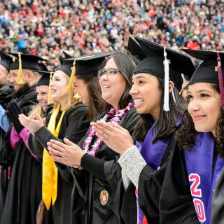 Graduates celebrate as they sing Varsity.