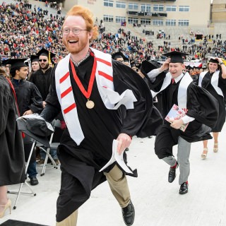 Graduates run towards the future after the event ends, and with it goes the end to their college careers.