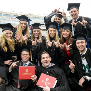 A group of friends celebrates their transition from students to Badger alumni.