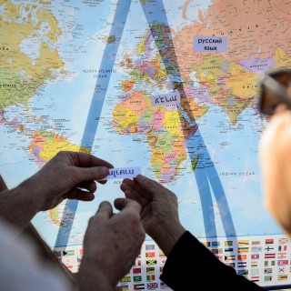 Photo: At a table sponsored by Languages at UW-Madison, people test their knowledge by matching the names of international languages with the countries where the language is spoken.