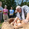 Photo: Kenoyer putting pottery into kiln