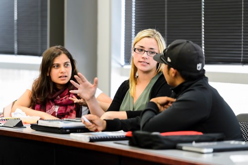 Photo: Aleks Talsky, seated at center and an undergraduate from UW-Milwaukee, makes a point as students discuss election law in a class taught by Steven Wright, a clinical instructor with the Wisconsin Innocence Project, during a closing session of the inaugural James E. Jones Jr. Pre-Law Scholars Program at the Law Building at UW–Madison on June 29.