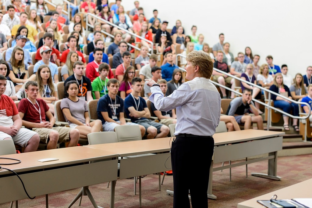 Photo: Lori Berquam speaking to crowd of students