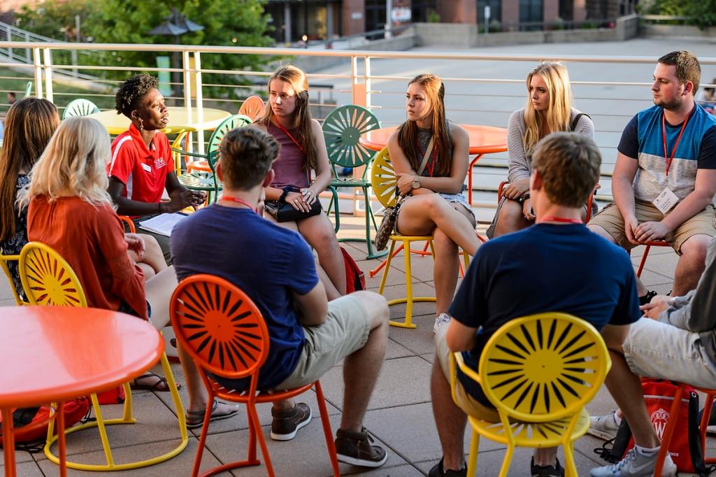 Photo: Kennedie King talking with small group