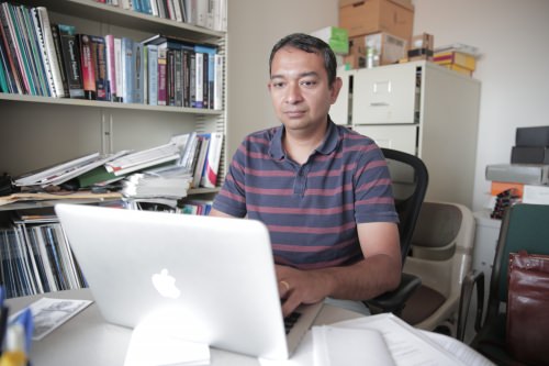 Suman Banerjee at his computer.