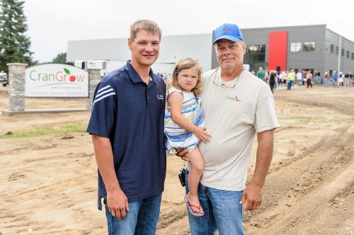 Adam Nemitz, daughter TK and father Robert represent three generations of cranberry growers near Warrens, Wisconsin. The Crangrow cooperative in Warrens, just down the road from their marshes, celebrated its grand opening Aug. 11, 2016. 