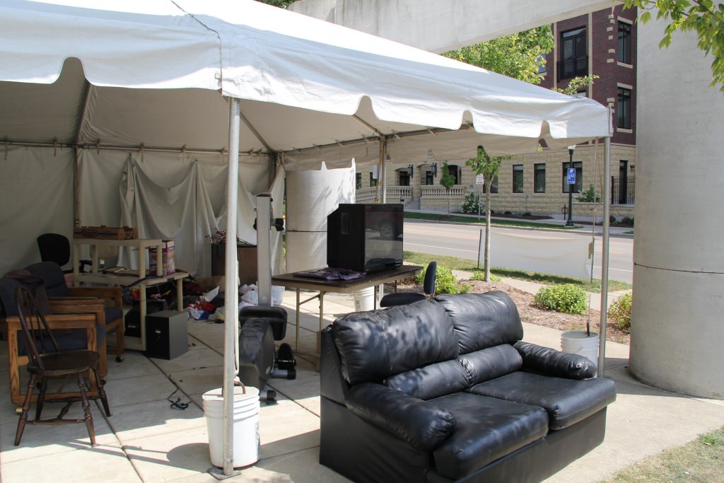 Belongings somebody didn't want are gathered at a donate-and-take station during  August moving days last year.