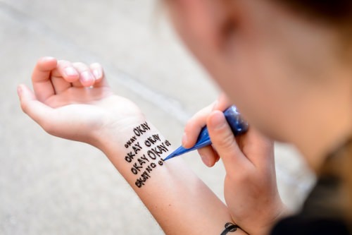 Photo: Lucy Hodkiewicz with henna tatto saying "Okay okay okay ..."