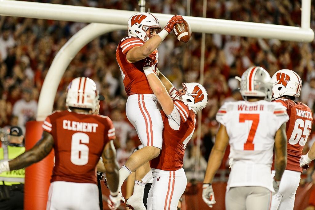 UW Badger fullback Austin Ramesh (20) celebrates a touchdown in the fourth quarter.