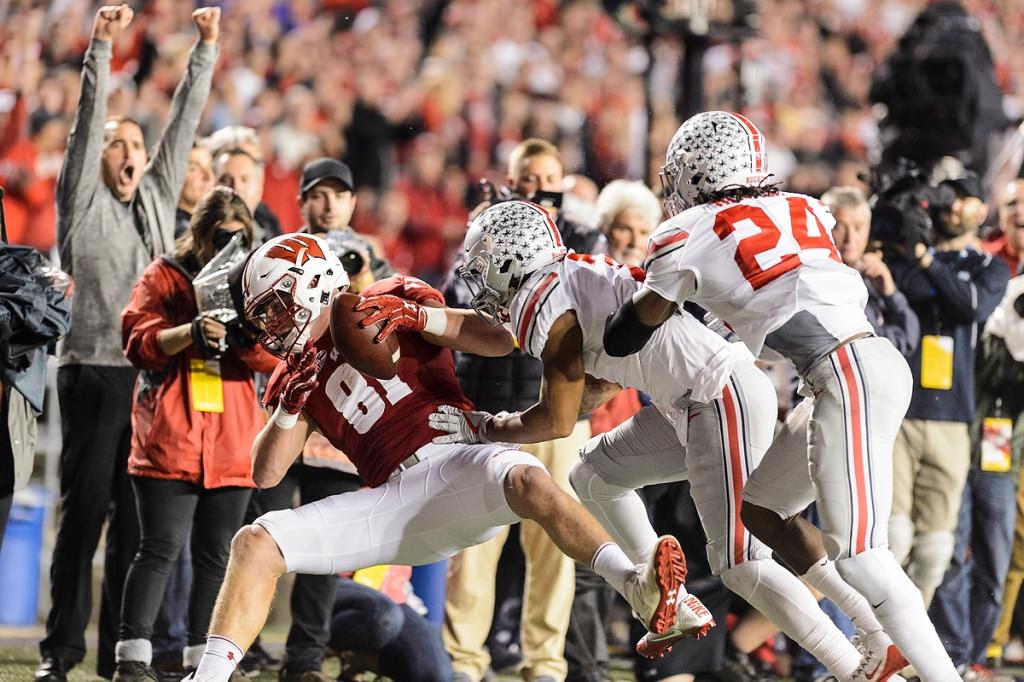 Wisconsin tight end Troy Fumagalli (81) takes in a big play at the sideline.