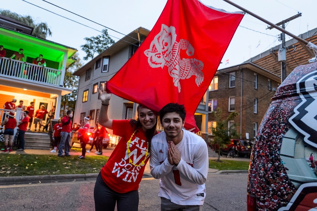 Fans wave the flag at a pre-game tailgate.