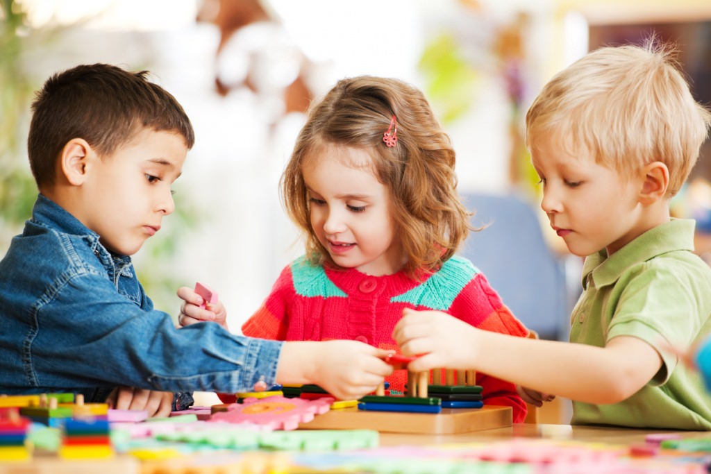 Photo: Children playing with puzzle